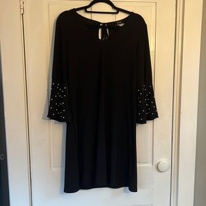 Short black dress with pearl detail